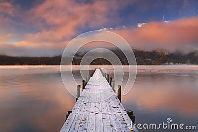 Jetty in Lake Chuzenji, Japan at sunrise in autumn Stock Photo